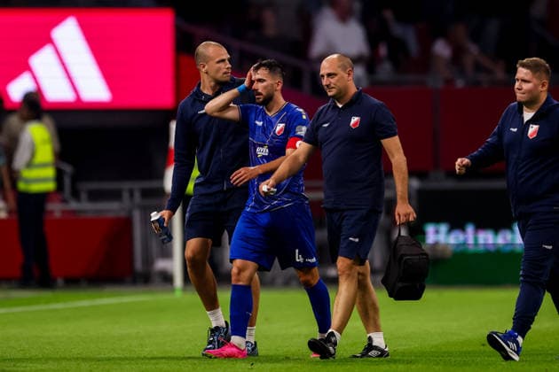AMSTERDAM, NETHERLANDS - JULY 30: Marko Poletanovic of FK Vojvodina receives medical attention after the UEFA Conference League 2026 27 second qualifying round second leg match between AFC Ajax and at Johan Cruijff Arena on July 30, 2026 in Amsterdam, Netherlands.  Copyright: xRenexNijhuis MBxMediax
