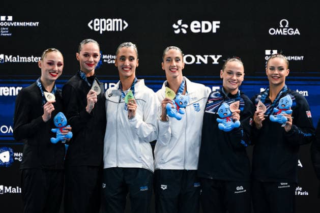 Maiia Doroshko and Aleksandra Shmidt Neutral Athletes B, silver, Anna Maria Alexandri and Eirini Marina Alexandri of Greece, gold, Kate Shortman and Isabelle Thorpe of Great Britain, bronze attend the medal ceremony of the artistic swimming Duet Tech Final during the European Aquatics Championships at the Olympic Aquatic Center in Paris (France), July 31, 2026. Andrea Staccioli