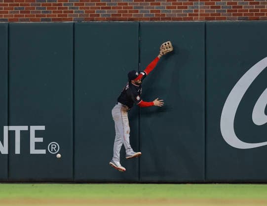 Right fielder Dylan Crews 3 of the Washington Nationals can t come up with a ball hit off the wall by first baseman Matt Olson 28 of the Atlanta Braves (not pictured) in the sixth inning at Truist Park on Friday, July 31, 2026 in Atlanta, Georgia.  ATL20260731119 MikexZarrilli