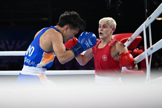 COM26 BOXING, Jye Dixon of Australia competes with Jadumani Singh Mandengbam of India during the Men™s 55kg Final Bout of the Glasgow 2026 Commonwealth Games at SEC Centre in Glasgow, Scotland, Saturday, August 1, 2026. ( NO ARCHIVING, EDITORIAL USE ONLY Glasgow Scotland United Kingdom  Copyright: xLUKASxCOCHx 20260801157309241208