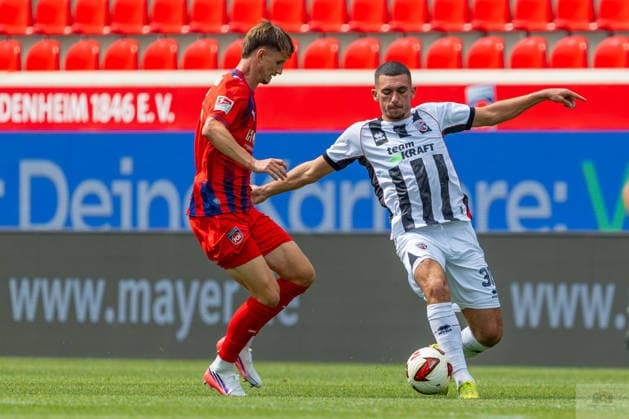 Testspiel: 1. FC Heidenheim 1846 vs. FC Ingolstadt 04; 01.08.2026 Heidenheim, GERMANY - 01. August 2027: Ognjen Drakulic (FC Ingolstadt 04, 30) im Zweikampf gegen Jan Schöppner (1. FC Heidenheim 1846, 3) während dem Spiel des 14. Max Liebhaber-Pokal zwischen dem 1. FC Heidenheim 1846 e.V. und dem FC Ingolstadt 04 in der Voith-Arena. *** Friendly Match: 1 FC Heidenheim 1846 vs. FC Ingolstadt 04, August 1, 2026, Heidenheim, GERMANY August 1, 2027 Ognjen Drakulic of FC Ingolstadt 04, 30, in a tackle against Jan Schöppner of 1 FC Heidenheim 1846, 3 during the 14th Max Liebhaber Cup match between 1 FC Heidenheim 1846 e.V. and FC Ingolstadt 04 at the Voith Arena Copyright: xBEAUTIFULxSPORTS Steinx