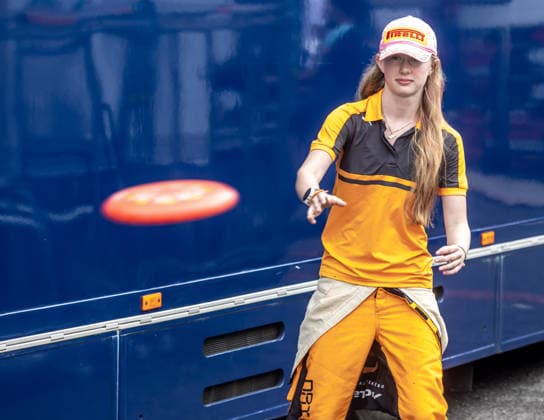 Ella Hakkinen, the daughter of former Finnish race car driver and Formula 1 driver Mika Hakkinen and his wife Marketa, plays frisbee at the pit area in Most, where she will compete in Formula 4, on August 1st, 2026. Snapshots from the afternoon before the race. (CTKxPhoto VojtechxHajek) CTKPhotoF202608010007101  CTKPhotoF202608010007101