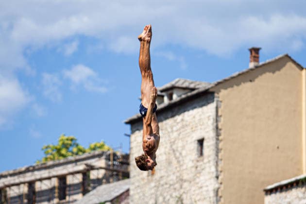 Red Bull Cliff Diving spectacle draws thousands of spectators to Mostar MOSTAR, BOSNIA AND HERZEGOVINA - AUGUST 01: The world s top cliff divers gather in Mostar, Bosnia and Herzegovina for the Red Bull Cliff Diving World Series, held at the iconic Old Bridge, one of the country s most recognizable landmarks on August 01, 2026. Athletes performed dives from heights of 27 meters for men and 21 meters for women, showcasing exceptional precision, technique and courage before thousands of spectators lining the banks of the Neretva River and the city s historic Old Town. Mostar is once again hosting one of the most spectacular events in the world of extreme sports, bringing together the world s best cliff divers while attracting thousands of local and international visitors. Denis Zuberi Anadolu Mostar Bosnia and Herzegovina. Editorial use only. Please get in touch for any other usage.  Copyright: x2026xAnadoluxDenisxZuberix