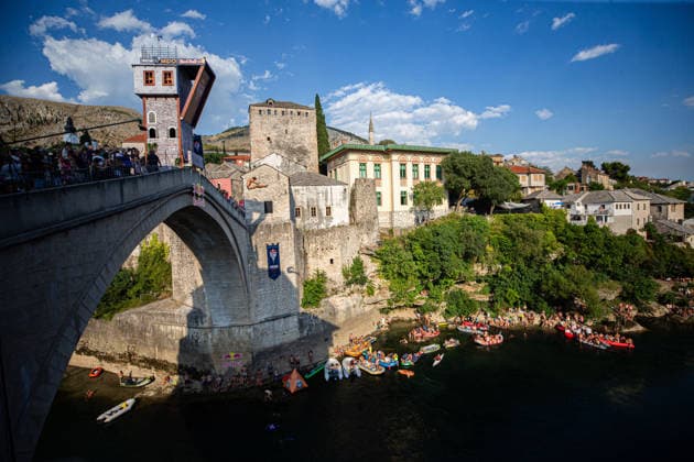 Red Bull Cliff Diving spectacle draws thousands of spectators to Mostar MOSTAR, BOSNIA AND HERZEGOVINA - AUGUST 01: The world s top cliff divers gather in Mostar, Bosnia and Herzegovina for the Red Bull Cliff Diving World Series, held at the iconic Old Bridge, one of the country s most recognizable landmarks on August 01, 2026. Athletes performed dives from heights of 27 meters for men and 21 meters for women, showcasing exceptional precision, technique and courage before thousands of spectators lining the banks of the Neretva River and the city s historic Old Town. Mostar is once again hosting one of the most spectacular events in the world of extreme sports, bringing together the world s best cliff divers while attracting thousands of local and international visitors. Denis Zuberi Anadolu Mostar Bosnia and Herzegovina. Editorial use only. Please get in touch for any other usage.  Copyright: x2026xAnadoluxDenisxZuberix