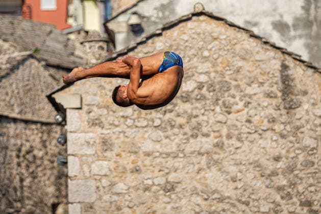 Red Bull Cliff Diving spectacle draws thousands of spectators to Mostar MOSTAR, BOSNIA AND HERZEGOVINA - AUGUST 01: The world s top cliff divers gather in Mostar, Bosnia and Herzegovina for the Red Bull Cliff Diving World Series, held at the iconic Old Bridge, one of the country s most recognizable landmarks on August 01, 2026. Athletes performed dives from heights of 27 meters for men and 21 meters for women, showcasing exceptional precision, technique and courage before thousands of spectators lining the banks of the Neretva River and the city s historic Old Town. Mostar is once again hosting one of the most spectacular events in the world of extreme sports, bringing together the world s best cliff divers while attracting thousands of local and international visitors. Denis Zuberi Anadolu Mostar Bosnia and Herzegovina. Editorial use only. Please get in touch for any other usage.  Copyright: x2026xAnadoluxDenisxZuberix