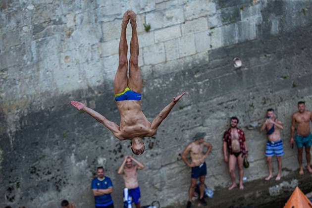 Red Bull Cliff Diving spectacle draws thousands of spectators to Mostar MOSTAR, BOSNIA AND HERZEGOVINA - AUGUST 01: The world s top cliff divers gather in Mostar, Bosnia and Herzegovina for the Red Bull Cliff Diving World Series, held at the iconic Old Bridge, one of the country s most recognizable landmarks on August 01, 2026. Athletes performed dives from heights of 27 meters for men and 21 meters for women, showcasing exceptional precision, technique and courage before thousands of spectators lining the banks of the Neretva River and the city s historic Old Town. Mostar is once again hosting one of the most spectacular events in the world of extreme sports, bringing together the world s best cliff divers while attracting thousands of local and international visitors. Denis Zuberi Anadolu Mostar Bosnia and Herzegovina. Editorial use only. Please get in touch for any other usage.  Copyright: x2026xAnadoluxDenisxZuberix
