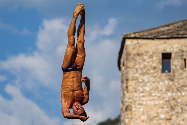 Red Bull Cliff Diving spectacle draws thousands of spectators to Mostar MOSTAR, BOSNIA AND HERZEGOVINA - AUGUST 01: The world s top cliff divers gather in Mostar, Bosnia and Herzegovina for the Red Bull Cliff Diving World Series, held at the iconic Old Bridge, one of the country s most recognizable landmarks on August 01, 2026. Athletes performed dives from heights of 27 meters for men and 21 meters for women, showcasing exceptional precision, technique and courage before thousands of spectators lining the banks of the Neretva River and the city s historic Old Town. Mostar is once again hosting one of the most spectacular events in the world of extreme sports, bringing together the world s best cliff divers while attracting thousands of local and international visitors. Denis Zuberi Anadolu Mostar Bosnia and Herzegovina. Editorial use only. Please get in touch for any other usage.  Copyright: x2026xAnadoluxDenisxZuberix