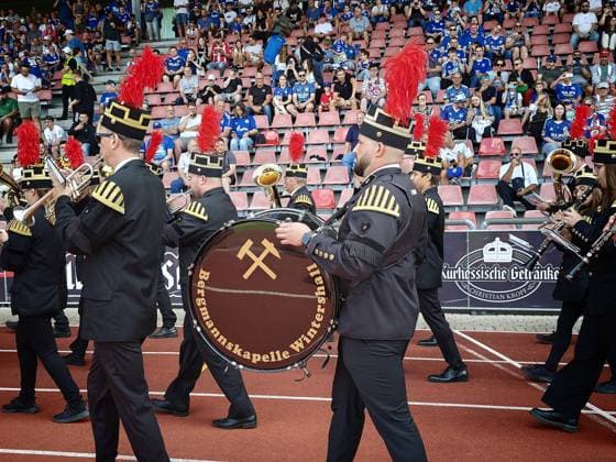 01.08.2026 xkhx Kassel Regionalliga Südwest Saison 2026 2027 - Bundesliga Freundschaftsspiel KSV Hessen Kassel - FC Schalke 04 Tradition Bergmannskapelle Wintershall läuft ins Stadion ein *** August 1, 2026 xkhx Kassel Regional League Southwest 2026–2027 Season Bundesliga Friendly Match KSV Hessen Kassel vs. FC Schalke 04 The Wintershall Miners Band enters the stadium