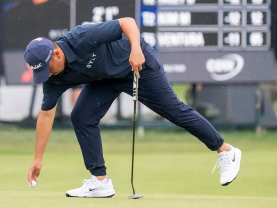 DETROIT, MI - AUGUST 01: Doug Ghim (USA) retrieves his ball from the hole during the third round of the Rocket Classic at Detroit Golf Club on August 01, 2026, in Detroit, Michigan. (Photo by Joseph Weiser Icon Sportswire) GOLF: AUG 01 PGA, Golf Herren Rocket Classic EDITORIAL USE ONLY Icon2608010683
