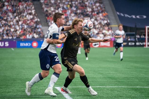 VANCOUVER, CANADA - AUGUST 1: Tate Johnson of Vancouver Whitecaps FC and Jacob Shaffelburg of Los Angeles FC battles for the ball during the Major League Soccer match between Vancouver Whitecaps FC and Los Angeles FC at BC Place Stadium on August 1, 2026 in Vancouver, British Columbia, Canada.  Copyright: xAmyxElle SPPx Sportspressphoto_SPR199352