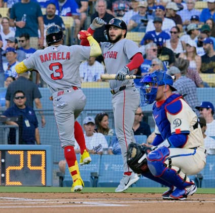 Boston Red Sox center fielder Ceddanne Rafaela (L) celebrates with Caleb Durbin after hitting a leadoff solo home run against Los Angeles Dodger starting pitcher Yoshinobu Yamamoto in the first inning at Dodger Stadium in Los Angeles on Saturday, August 1, 2026.  LAP2026080106 JIMxRUYMEN