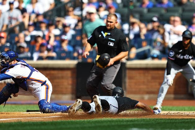 MLB, Baseball Herren, USA Miami Marlins Vs. New York Mets Miami Marlins player Otto Lopez, number 6, slides into home plate to score during the second inning of a baseball game against the New York Mets at Citi Field in Flushing, New York, on August 1, 2026. Flushing N.Y. United States  Copyright: xGordonxDonovanx originalFilename:donovan-mlbmiami260801_npyAm.jpg