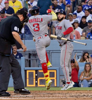 Boston Red Sox center fielder Ceddanne Rafaela (L) celebrates with Caleb Durbin after hitting a solo home run against Los Angeles Dodger starting pitcher Yoshinobu Yamamoto in the third inning at Dodger Stadium in Los Angeles on Saturday, August 1, 2026. It was the second multi-homer game of Rafaela s career.  LAP2026080114 JIMxRUYMEN