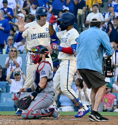 Los Angeles Dodger right fielder Teoscar Hernandez celebrates with Freddie Freeman after hitting a two-run homer in the second inning against the Boston Red Sox at Dodger Stadium in Los Angeles on Saturday, August 1, 2026.  LAP2026080109 JIMxRUYMEN