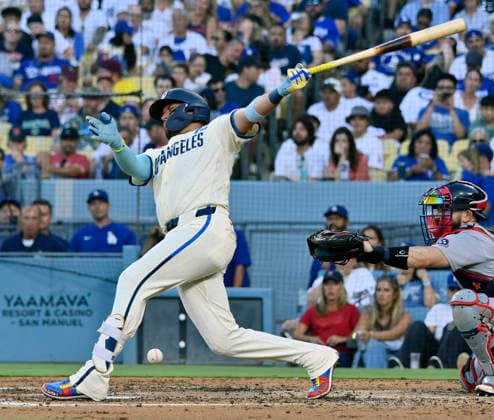 Los Angeles Dodgers shortstop Miguel Rojas reacts after hitting the ball off his leg in the fourth inning at Dodger Stadium against the Boston Red Sox in Los Angeles on Saturday, August 1, 2026.  LAP2026080115 JIMxRUYMEN