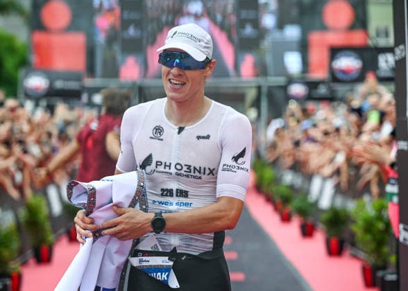 TRIATHLON: Stepniak And Bartlett Secure Elite Victories At IRONMAN 70.3 Krakow KRAKOW, POLAND - AUGUST 02: Professional triathlete Kacper Stepniak of Poland holds the finish line tape and smiles after winning the Enea IRONMAN 70.3 Krakow triathlon on the Main Market Square in Krakow, Lesser Poland Voivodeship, Poland, on August 02, 2026. Stepniak successfully defended his championship title, securing first place in the elite professional division with an official time of 3:36:37 following a 113-kilometer (70.3-mile) endurance race across the region. Krakow Poland  Copyright: xArturxWidakx originalFilename:widak-triathlo260802_npSun.jpg