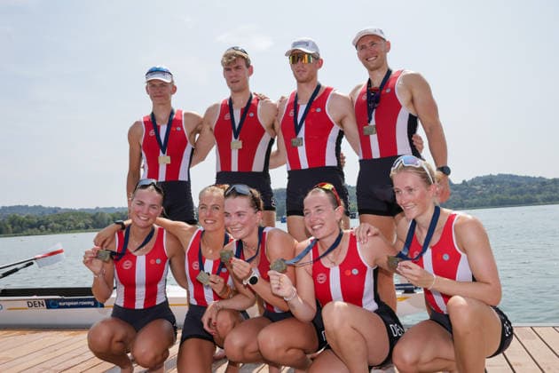 RECORD DATE NOT STATED 2nd August 2026; Lake Varese, Varese, Lombardy, Italy; 2026 European Rowing Championships, Day Three; the medal ceremony, Mixed Eight (Mix8+), Denmark bronze medallists AnthonyxBenoit
