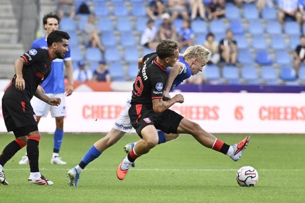 Twente s Aske Adelgaard and Genk s Jeppe Erenbjerg fight for the ball during a friendly soccer game between Racing Genk vs FC Twente, on Sunday 02 August 2026 in Genk, in preparation of the upcoming 2026-2027 Belgian first division soccer season. JOHAN EYCKENS JohanxEyckens  x182628710x
