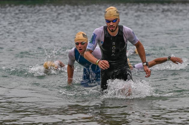 TRIATHLON: Stepniak And Bartlett Secure Elite Victories At IRONMAN 70.3 Krakow KRAKOW, POLAND - AUGUST 02: Elite professional triathletes push through the shallows as they exit the water during the swim-to-bike transition stage of the Enea IRONMAN 70.3 Krakow triathlon at the Zakrzowek Reservoir in Krakow, Lesser Poland Voivodeship, Poland, on August 02, 2026. The professional field initiated the premier multi endurance race with a morning 1.9-kilometer open-water swim inside the flooded limestone quarry before making their way toward the Transition 1 (T1) zone to begin the 90-kilometer cycling segment. Krakow Poland  Copyright: xArturxWidakx originalFilename:widak-triathlo260802_npEsR.jpg