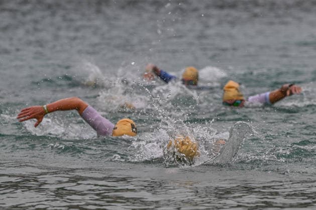 TRIATHLON: Stepniak And Bartlett Secure Elite Victories At IRONMAN 70.3 Krakow KRAKOW, POLAND - AUGUST 02: Elite professional triathletes wearing gold swim caps cut through the water during the 1.9-kilometer swimming leg of the Enea IRONMAN 70.3 Krakow triathlon at the Zakrzowek Reservoir in Krakow, Lesser Poland Voivodeship, Poland, on August 02, 2026. The professional field initiated the premier endurance competition with an open-water swim inside the flooded limestone quarry before transitioning to a 90-kilometer cycling stage and a final 21.1-kilometer run route culminating at the historic Main Market Square. Krakow Poland  Copyright: xArturxWidakx originalFilename:widak-triathlo260802_npxyC.jpg