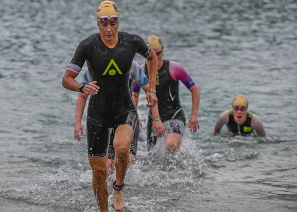 TRIATHLON: Stepniak And Bartlett Secure Elite Victories At IRONMAN 70.3 Krakow KRAKOW, POLAND - AUGUST 02: Elite professional triathletes push through the shallows as they exit the water during the women s swim-to-bike transition stage of the Enea IRONMAN 70.3 Krakow triathlon at the Zakrzowek Reservoir in Krakow, Lesser Poland Voivodeship, Poland, on August 02, 2026. The women s professional field completed the 1.9-kilometer open-water swim stage inside the flooded limestone quarry before sprinting up the exit ramp toward the Transition 1 (T1) zone to begin the 90-kilometer cycling segment. Krakow Poland  Copyright: xArturxWidakx originalFilename:widak-triathlo260802_npQ6O.jpg