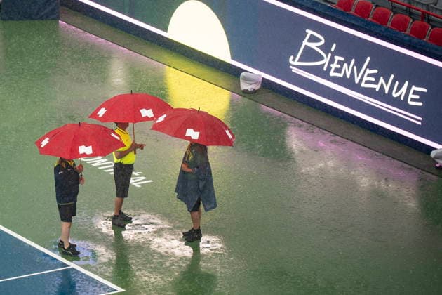 August 3, 2026, Montreal, Pq, Canada: People use umbrellas during a rain delay, on day two of the National Bank Open tennis tournament in Montreal on Monday August 3, 2026. Canada News - August 3, 2026  - ZUMAc35_ 20260803_zaf_c35_001 Copyright: xChristopherxKatsarovx