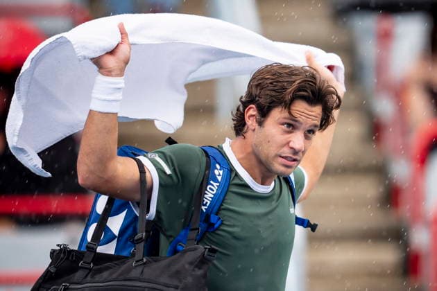 August 3, 2026, Montreal, Pq, Canada: Alexis Galarneau of Canada walks off the court due to a rain delay during his first round match against Vit Kopriva, of Czechia, on day two of the National Bank Open tennis tournament in Montreal on Monday August 3, 2026. Canada News - August 3, 2026  - ZUMAc35_ 20260803_zaf_c35_012 Copyright: xChristopherxKatsarovx