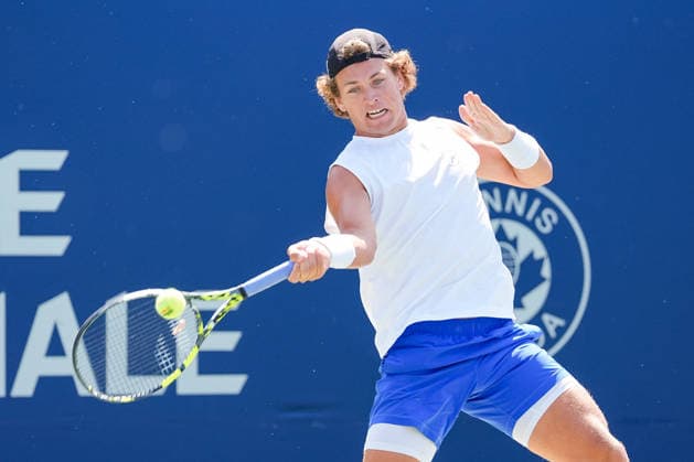 MONTREAL, QC - AUGUST 04: Liam Draxl (CAN) returns the ball during a first round match at National Bank Open on August 04, 2026 at IGA Stadium in Montreal, QC (Photo by David Kirouac Icon Sportswire) TENNIS: AUG 04 National Bank Open EDITORIAL USE ONLY Icon26080404926