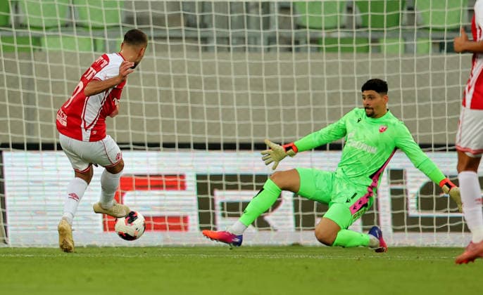Crvena Zvezda v Hapoel Beer Sheva, UEFA Champions League third qualifying round, first leg, Season 2026 2027 Szombathely, Hungary. 4th August, 2026. Hapoel s Zahi Ahmad scores goal during past Crvena Zvezda s goalkeeper Lima Magalhaes Matheus the UEFA Champions League third qualifying round, first leg football match between Crvena Zvezda (Red Star) and Hapoel Be er Sheva at the Haladas Stadium on August 4, 2026 in Szombathely, Hungary. Szombathely Hungary Copyright: xPedjaxMilosavljevicx x