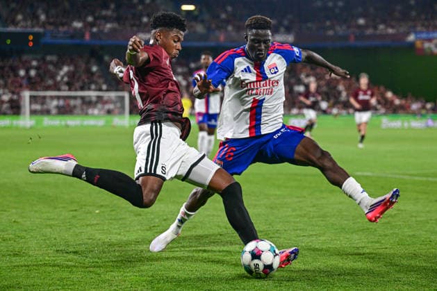 From left John Mercado of Sparta and Abner Vinicius of Lyon in action during the 1st leg, 3rd qualifying round match of the Football Champions League between Sparta Praha and Olympique Lyon, on August 4, 2026, in Prague, Czech Republic. (CTKxPhoto OndrejxDeml) CTKPhotoP2026080406958  CTKPhotoP2026080406958