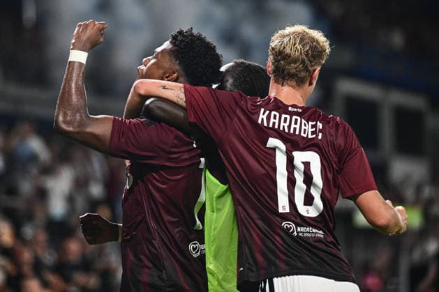 John Mercado, left, and Adam Karabec of Sparta celebrate a goal during the 1st leg, 3rd qualifying round match of the Football Champions League between Sparta Praha and Olympique Lyon, on August 4, 2026, in Prague, Czech Republic. (CTKxPhoto OndrejxDeml) CTKPhotoP2026080407066  CTKPhotoP2026080407066