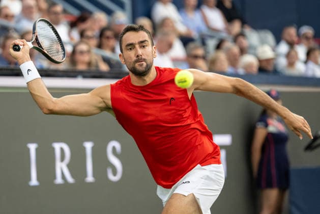 MONTREAL, QC - AUGUST 04: Marin Cilic from Croatia returns the ball against Frances Tiafoe from USA during their singles second round match on day three of the ATP, Tennis Herren 1000 National Bank Open presented by Rogers at Stade IGA on August 4, 2026 in Montreal, Quebec, Canada. (Photo by Vincent Ethier Icon Sportswire) TENNIS: AUG 04 National Bank Open EDITORIAL USE ONLY Icon270804031