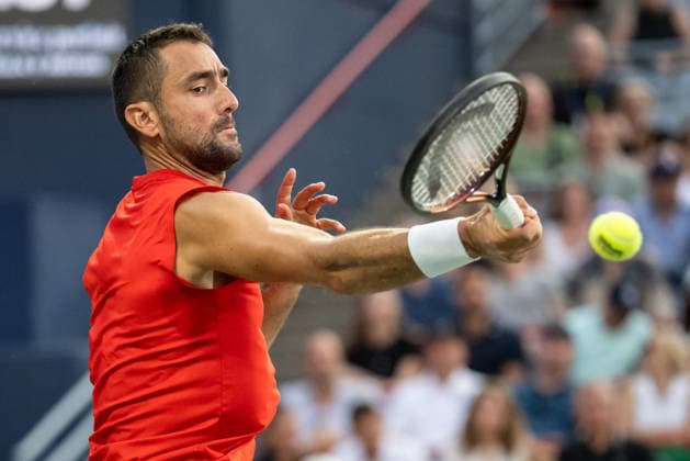 MONTREAL, QC - AUGUST 04: Marin Cilic from Croatia returns the ball against Frances Tiafoe from USA during their singles second round match on day three of the ATP, Tennis Herren 1000 National Bank Open presented by Rogers at Stade IGA on August 4, 2026 in Montreal, Quebec, Canada. (Photo by Vincent Ethier Icon Sportswire) TENNIS: AUG 04 National Bank Open EDITORIAL USE ONLY Icon270804036