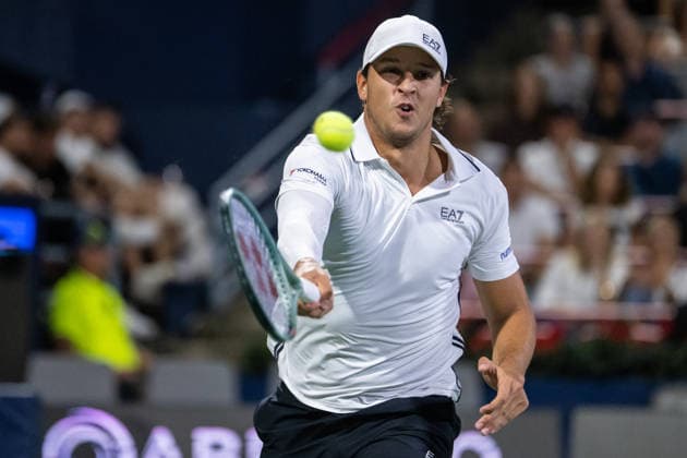 MONTREAL, QC - AUGUST 04: Luciano Darderi from Italia returns the ball against Gabriel Diallo from Canada from Italia during their singles second round match on day three of the ATP, Tennis Herren 1000 National Bank Open presented by Rogers at Stade IGA on August 4, 2026 in Montreal, Quebec, Canada. (Photo by Vincent Ethier Icon Sportswire) TENNIS: AUG 04 National Bank Open EDITORIAL USE ONLY Icon270804122