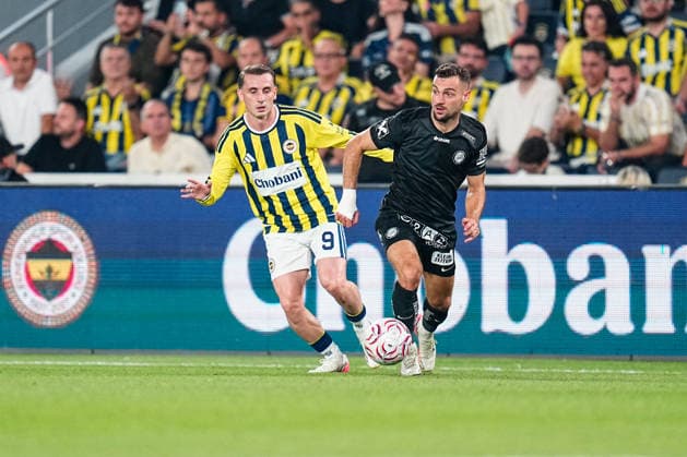 Fenerbahce SK v Sturm Graz - UEFA Champions League 2026 27 Third Qualifying Round First Leg Jurgen Heil of Sturm Graz in action with Kerem Akturkoglu of Fenerbahce during the UEFA Champions League 2026 27 third qualifying round first leg match between Fenerbahce SK and Sturm Graz at Fenerbahce Sükrü Saracoglu Spor Kompleksi on August 05, 2026 in Istanbul, Turkey. Istanbul Fenerbahce Sükrü Saracoglu Spo Istanbul Turkey Copyright: xxYagizxGurtugx