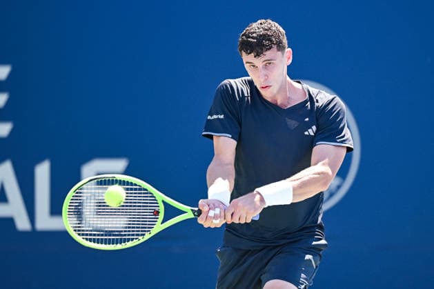 MONTREAL, QC - AUGUST 05: Juan Manuel Cerundolo (ARG) returns the ball during a second round match at National Bank Open on August 05, 2026 at IGA Stadium in Montreal, QC (Photo by David Kirouac Icon Sportswire) TENNIS: AUG 05 National Bank Open EDITORIAL USE ONLY Icon26080506126