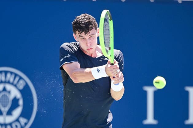 MONTREAL, QC - AUGUST 05: Juan Manuel Cerundolo (ARG) returns the ball during a second round match at National Bank Open on August 05, 2026 at IGA Stadium in Montreal, QC (Photo by David Kirouac Icon Sportswire) TENNIS: AUG 05 National Bank Open EDITORIAL USE ONLY Icon26080506226