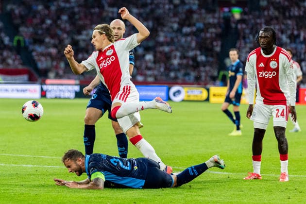 AFC Ajax v Shelbourne FC - UEFA Conference League AMSTERDAM, NETHERLANDS - AUGUST 6: Mika Godts of AFC Ajax and Patrick Barrett of Shelbourne FC during the UEFA Conference League match between AFC Ajax and Shelbourne FC at Johan Cruijff Arena on August 6, 2026 in Amsterdam, Netherlands. Amsterdam Johan Cruijff Arena Netherlands Content not available for redistribution in The Netherlands directly or indirectly through any third parties. Copyright: xMarcelxvanxPlateringenx