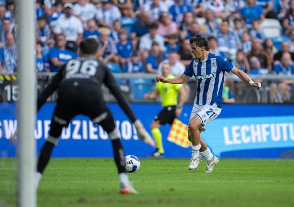 Pablo Rodriguez of Lech Poznan takes a shot, Mark Jensen of KI Klaksvik defends the goal during UEFA Conference League - Third Qualifying Round season 26 27 match between teams of Lech Poznan and KI Klaksvik (Ruslan Taran Ball Raw Images) Poznan Enea Stadion Poland Copyright: xRuslanxTaranx RUS_LPOvKLA-0074