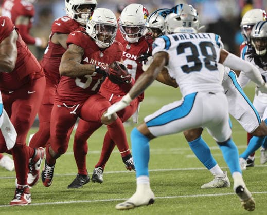 Arizona Cardinals running back Corey Kiner (37) looks to make a move on Carolina Panthers Zakee Wheatley (38) during the second quarter of their preseason game at the Pro Football Hall of Fame Game in Canton, Ohio, on Thursday, August 6, 2026.  CAN20260806117 AARONxJOSEFCZYK