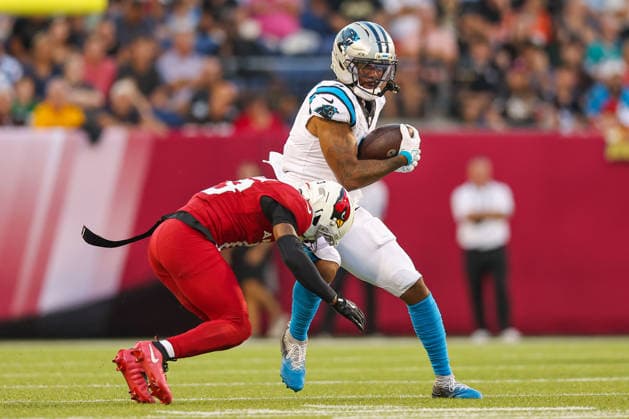August 6, 2026, Canton, Ohio, USA: Carolina Panthers player attempts to escape a tackle form Arizona Cardinals player at the 2026 Pro Football Hall of Fame Game between the Carolina Panthers and Arizona Cardinals at Tom Benson Hall of Fame Stadium on August 6, 2026 in Canton, Ohio. Canton USA - ZUMAs335 20260806_znp_s335_021 Copyright: xMatthewxSmithx