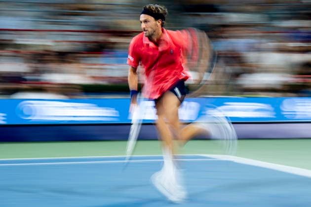 August 6, 2026, Montreal, Pq, Canada: Arthur Rinderknech of France chases a shot from Frances Tiafoe of the United States on day five of the National Bank Open tennis tournament in Montreal on Thursday, August 6, 2026. Canada News - August 6, 2026  - ZUMAc35_ 20260806_zaf_c35_137 Copyright: xChristopherxKatsarovx