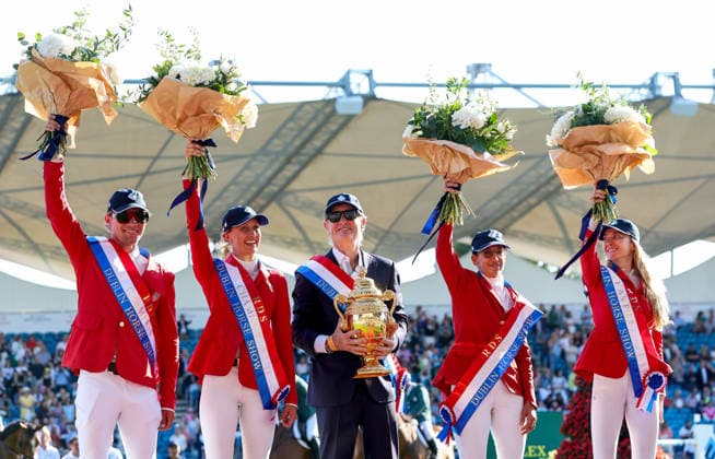 2026 Dublin Horse Show, Laya Arena, Dublin 7 8 2026 Nations™ Cup of Ireland for award of the Aga Khan Trophy The United States of America team celebrate on the winners podium with the Aga Khan Trophy The United States of America team celebrate on the winners podium with the Aga Khan Trophy 7 8 2026  Copyright: xx DC3A9850