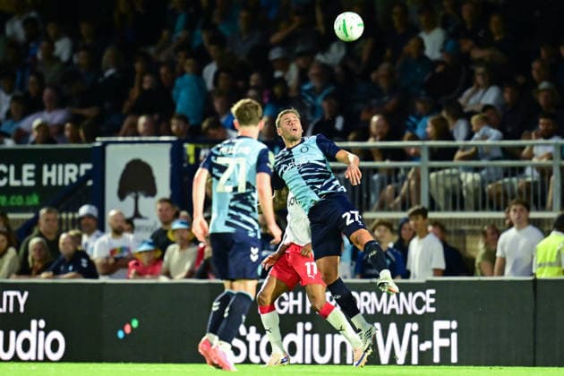 Wycombe Wanderers v Stevenage, EFL Cup Wycombe Wanderers defender Steve Cook (27) heads the ball during the EFL Cup match between Wycombe Wanderers and Stevenage at Adams Park, High Wycombe, UK on 7 August 2026. High Wycombe Adams Park Buckinghamshire UK Editorial use only DataCo restrictions apply See www.football-dataco.com , Copyright: xDennisxGoodwinx PSI-24673-0030