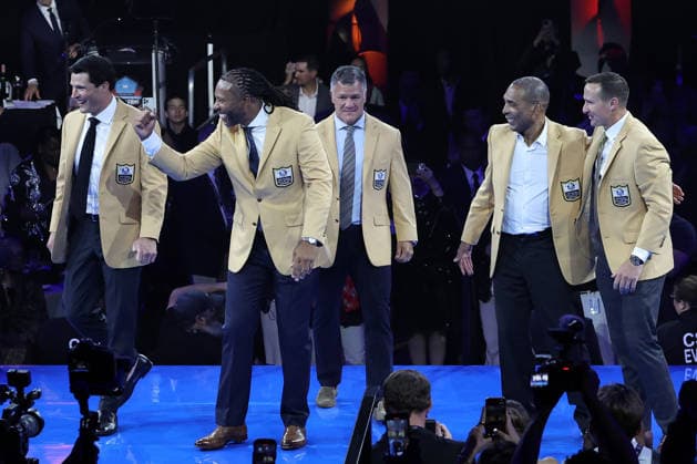 The 2026 Pro Football Hall of Fame Class (L-R) Luke Kuechly,Larry Fitzgerald,Adam Vinatieri,Roger Craig and Drew Brees celebrate after receiving their Gold Jacket at a ceremony Ceremony in Canton, Ohio, on Friday, August 7, 2026.  CAN20260807144 AARONxJOSEFCZYK