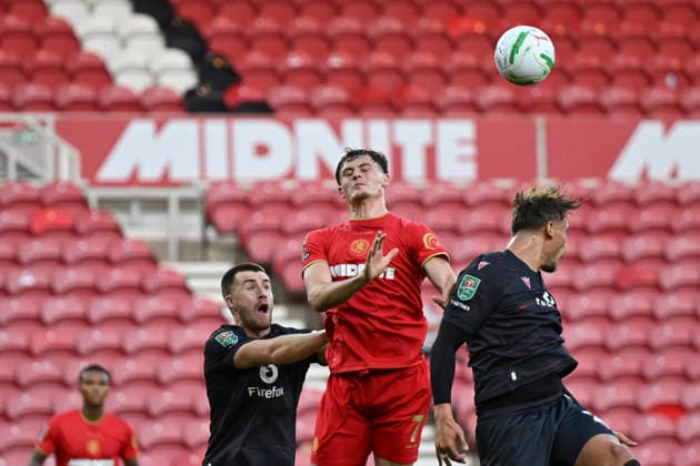 Middlesbrough v Wrexham - Carabao Cup First Round Callum Doyle of Wrexham AFC heads the ball away from an oncoming Will Lankshear of Middlesbrough during the Carabao Cup 1st Round match between Middlesbrough and Wrexham at the Riverside Stadium in Middlesbrough, United Kingdom. Middlesbrough North Yorkshire United Kingdom  Copyright: xMIxNewsx originalFilename:fletcher-middlesb260807_npyOT.jpg