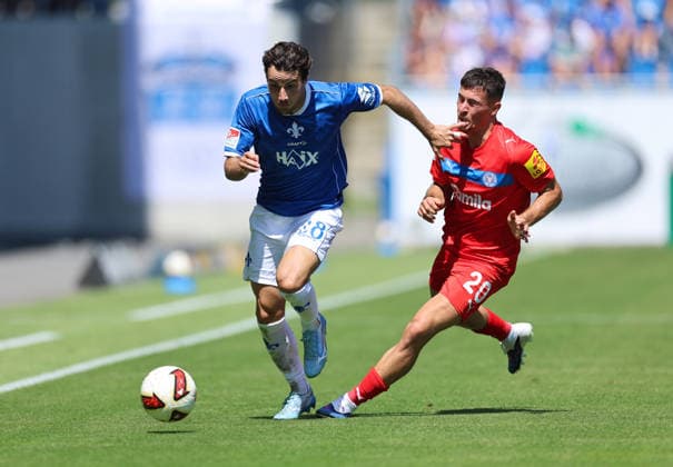 08.08.2026, Fussball 2. Bundesliga, SV Darmstadt 98 - Holstein Kiel, v.l., Christopher Lannert (SV Darmstadt 98), Adrian Kapralik (Holstein Kiel) DFL DFB REGULATIONS PROHIBIT ANY USE OF PHOTOGRAPHS AS IMAGE SEQUENCES AND OR QUASI-VIDEO. xdcx *** August 8, 2026, Soccer, 2. Bundesliga, SV Darmstadt 98 vs. Holstein Kiel, from left: Christopher Lannert (SV Darmstadt 98), Adrian Kapralik (Holstein Kiel). DFL and DFB regulations prohibit any use of photographs as image sequences and or quasi-video. xdcx Copyright: HMBxMedia Claus