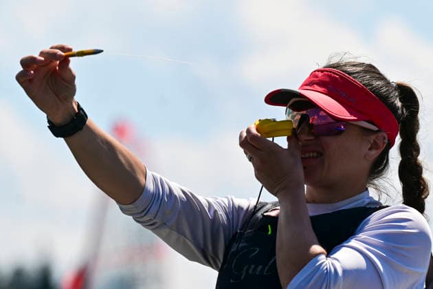 A judge measures the strength and consistency of the wind during the finals of the 29er class European Championship, EM, Europameisterschaft on Lipno Reservoir, on August 8, 2026, Cerna v Posumavi, Czech Republic. The races were affected by calm conditions. (CTKxPhoto VaclavxPancer) CTKPhotoP2026080803026  CTKPhotoP2026080803026