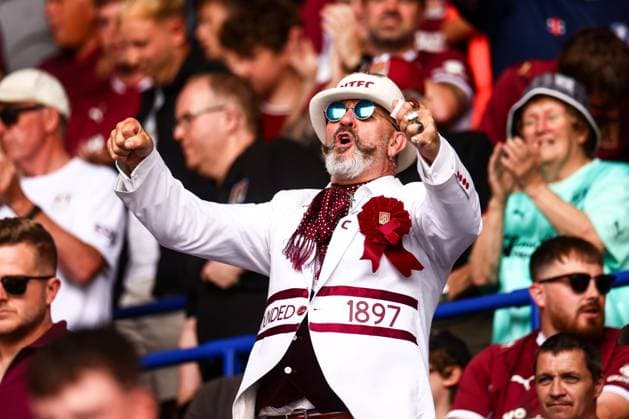 Northampton Town fans sing Leicester City v Northampton Town, EFL Carabao Cup, First Round, Football, King Power Stadium, Leicester, UK - 08 Aug 2026Leicester King Power Stadium United Kingdom EDITORIAL USE ONLY No use with unauthorised audio, video, data, fixture lists, club league logos or live services. Online in-match use limited to 120 images, no video emulation. No use in betting, games or single club league player publications.  Copyright: xMarkxKerton Shutterstockx 17051082ar