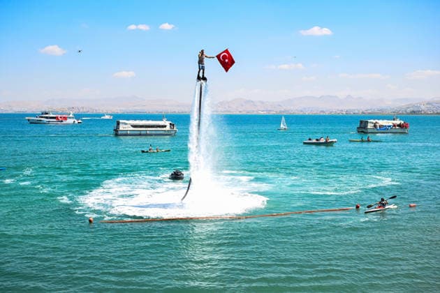 12th Van Sea Water Sports Festival kicks off on Lake Van VAN, TURKIYE - AUGUST 08: A view of participants and athletes taking part in the 12th Van Sea Water Sports Festival held at the Edremit-Gebze Water Sports Center on the shores of Lake Van in Van, Turkiye, on August 08, 2026. Organized to promote Lake Van and boost local tourism, the two-day event features Beach volleyball, Beachvolleyball and handball matches, flyboard demonstrations, canoeing, rowing, dragon boat races, and various recreational activities. Ozkan Bilgin Anadolu Van Turkey. Editorial use only. Please get in touch for any other usage.  Copyright: x2026xAnadoluxOzkanxBilginx